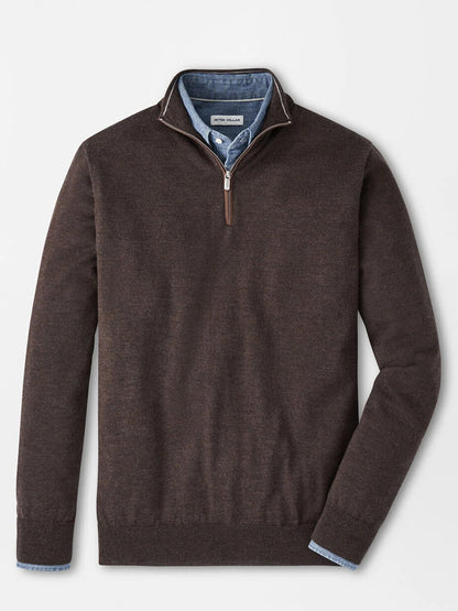 The Peter Millar Autumn Crest Suede Trim Quarter-Zip in French Press is layered over a blue button-down shirt, both displayed flat on a white background.