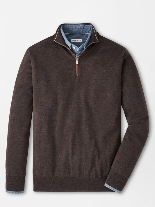 The Peter Millar Autumn Crest Suede Trim Quarter-Zip in French Press is layered over a blue button-down shirt, both displayed flat on a white background.