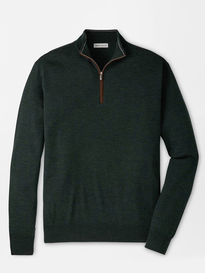 Peter Millar Autumn Crest Suede Trim Quarter-Zip in Pine Brook, a dark green Merino sweater in a classic fit, features a quarter-zip front with a brown zipper pull, long sleeves, and ribbed hem and cuffs. This lightweight sweater is displayed laid flat on a white background.