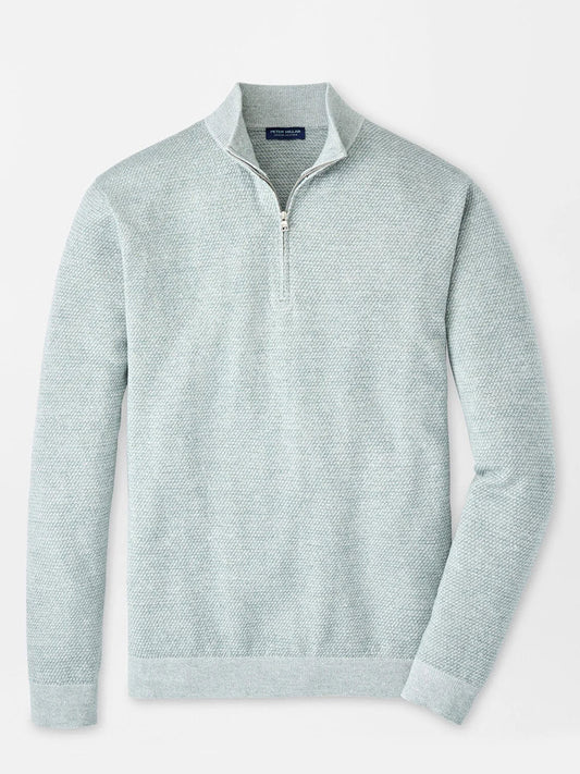 The Peter Millar Barlow Quarter-Zip Sweater in Willow is a light gray pullover crafted from a Merino-linen-cotton blend with textured birdseye jacquard knit, shown laid flat on a white background.