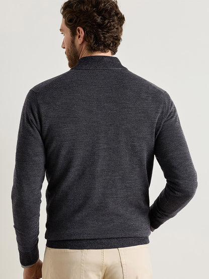A man viewed from the back wearing a charcoal Peter Millar Blair Birdseye Quarter-Zip Sweater in a classic fit with a textured birdseye stitch.