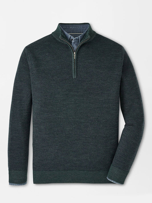 The Peter Millar Breaker Birdseye Quarter-Zip in Balsam, made from luxurious Merino wool and laid flat on a light background, showcases a refined birdseye stitch pattern. Ideal for 3-season wear, this piece seamlessly blends style with comfort.