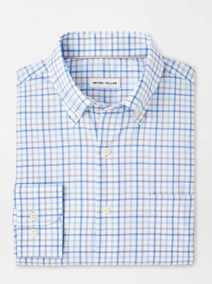 The Peter Millar Calgary Crown Lite Cotton-Stretch Sport Shirt in Blue Poppy features a light blue and white checkered design, a button-down collar, and is made from easy-care fabric.