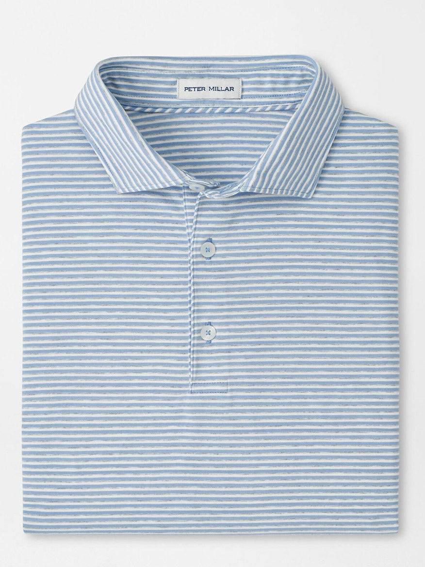 A Peter Millar Calvert Crown Flex Cotton Polo in Cloudy Blue, with light blue and white stripes, a collar, three buttons, and "Peter Millar" labeled inside the collar.