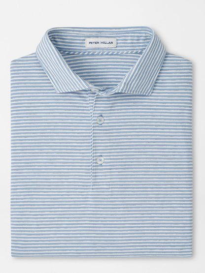 A Peter Millar Calvert Crown Flex Cotton Polo in Cloudy Blue, with light blue and white stripes, a collar, three buttons, and "Peter Millar" labeled inside the collar.