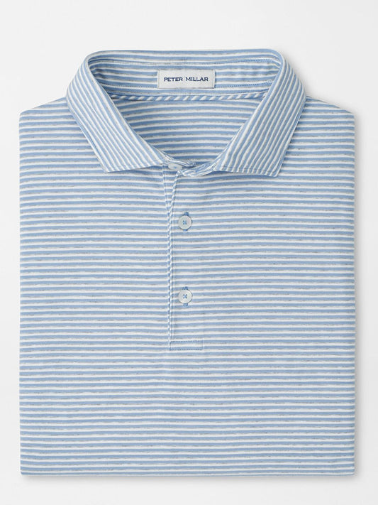 A Peter Millar Calvert Crown Flex Cotton Polo in Cloudy Blue, with light blue and white stripes, a collar, three buttons, and "Peter Millar" labeled inside the collar.