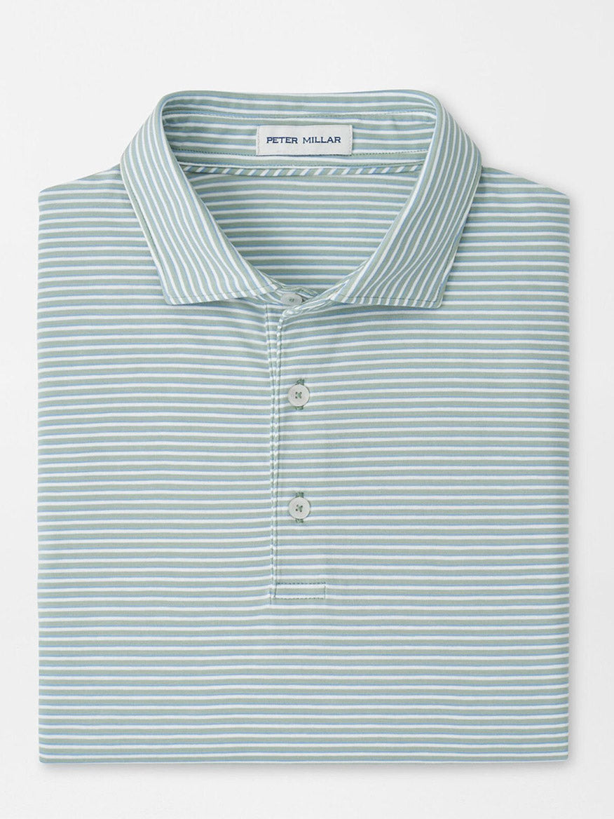 A folded Peter Millar Calvert Crown Flex Cotton Polo in Grandview, featuring a light blue color with white horizontal stripes and an inside collar label.