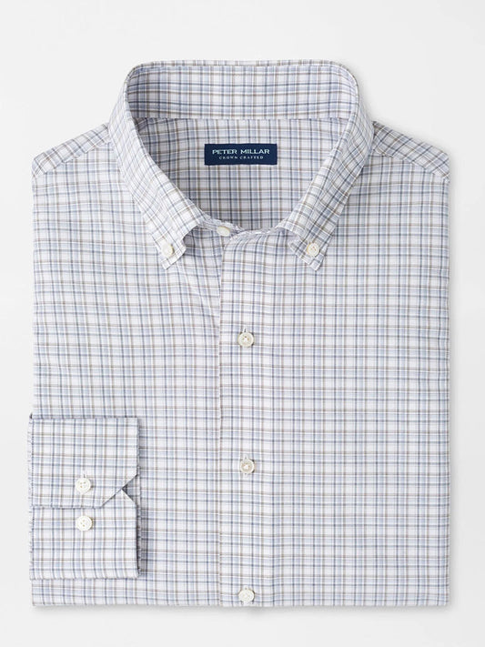 The Peter Millar Carter Performance Poplin Sport Shirt in Nebula Blue features a blue and gray plaid, button-down collar, long sleeves, and offers UPF 50+ protection for all-day comfort and style.
