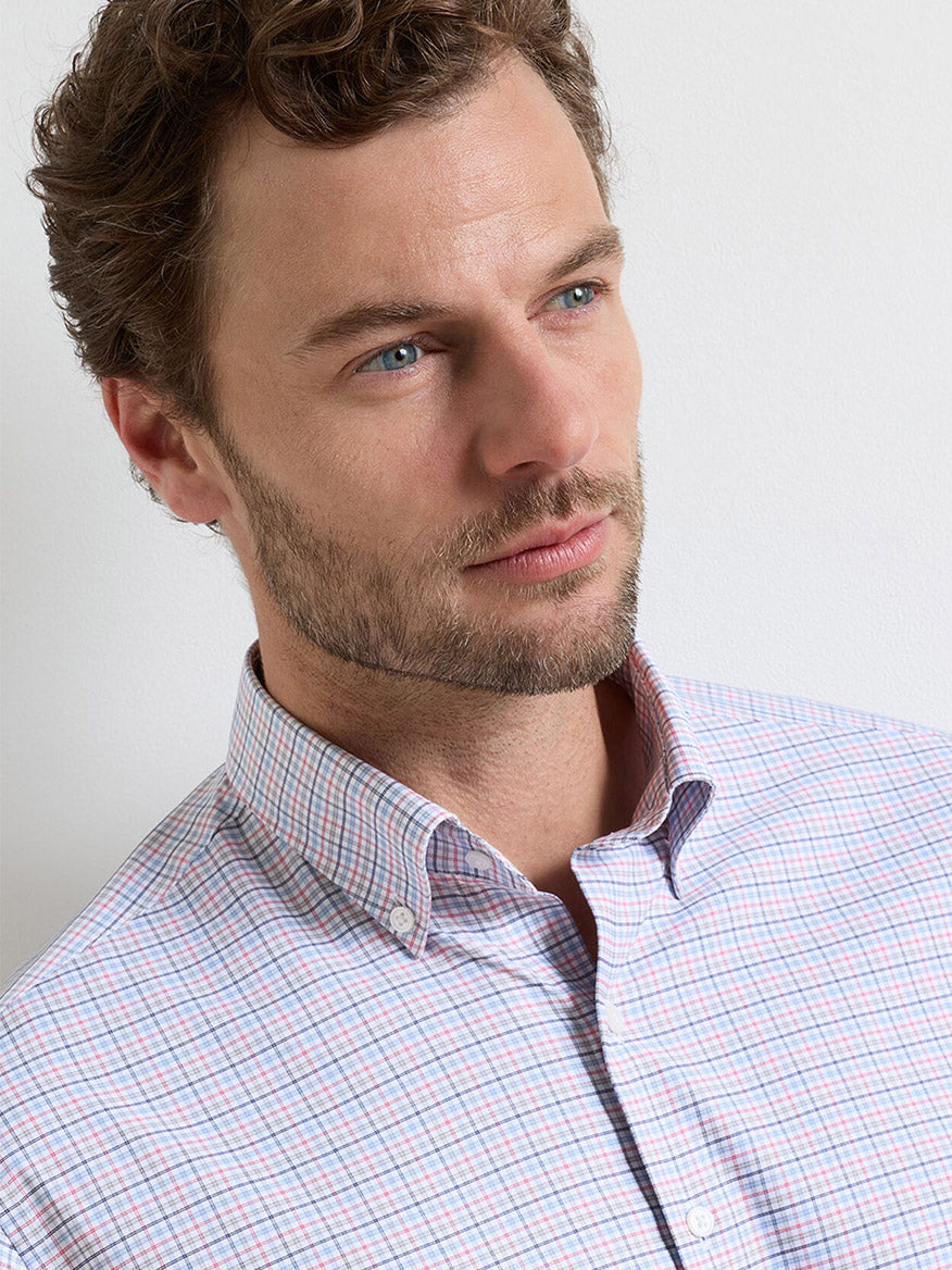A man with short brown hair and a beard wears the Peter Millar Casey Performance Twill Sport Shirt in Navy, looking slightly to the side against a plain white background.