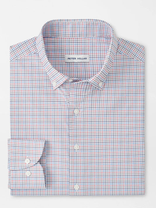A folded Peter Millar Casey Performance Twill Sport Shirt in Navy features a small red, blue, and white checkered pattern and is crafted from performance fabric for all-day comfort.