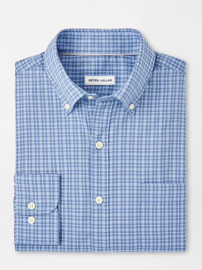 Peter Millar Caspian blue Freesia perfect pinpoint cotton-stretch sport shirt, featuring a folded design with a blue and white checkered pattern and a left chest pocket, displayed on a white background.