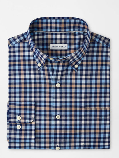 Discover the Peter Millar Chambly Crown Lite Cotton-Stretch Sport Shirt in Navy, designed with a blue, white, and brown plaid pattern and crafted from easy-care performance fabric.