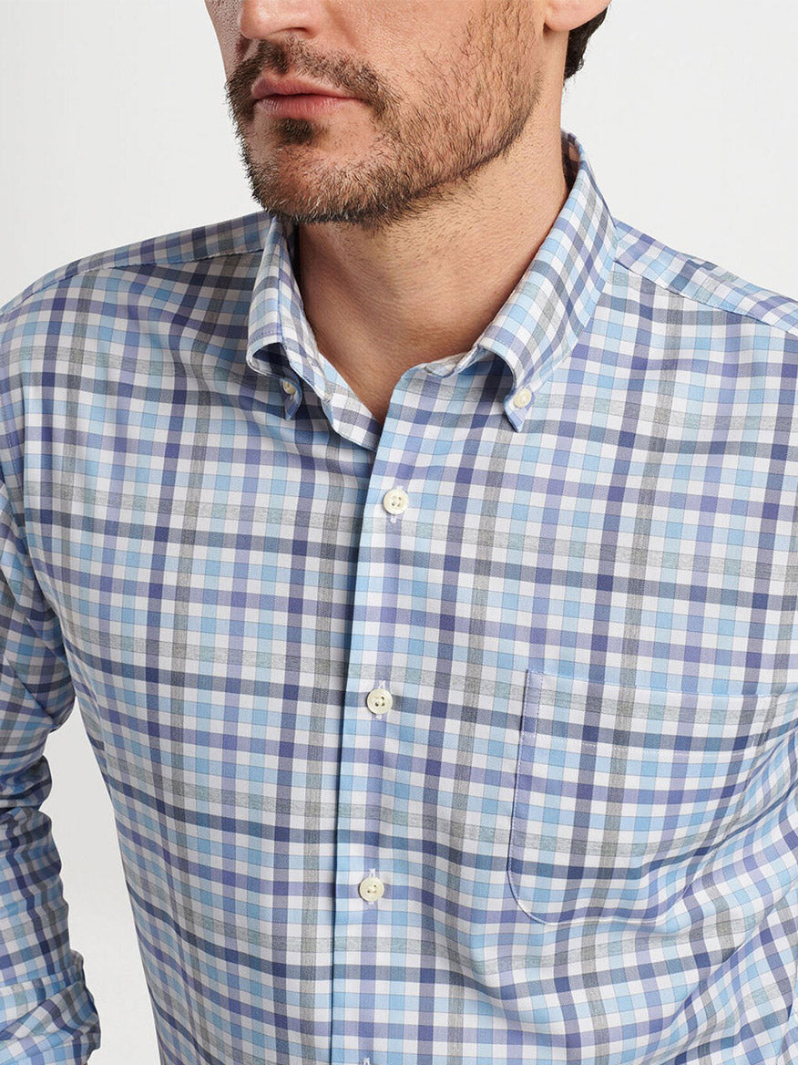 A person wearing a Peter Millar Chambly Crown Lite Cotton-Stretch Sport Shirt in White with a small left-side pocket. The person's face is partially visible.