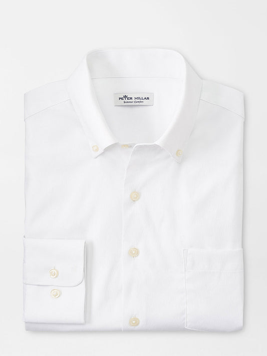 Folded Peter Millar Collins Performance Oxford Sport Shirt in White on a neutral background.