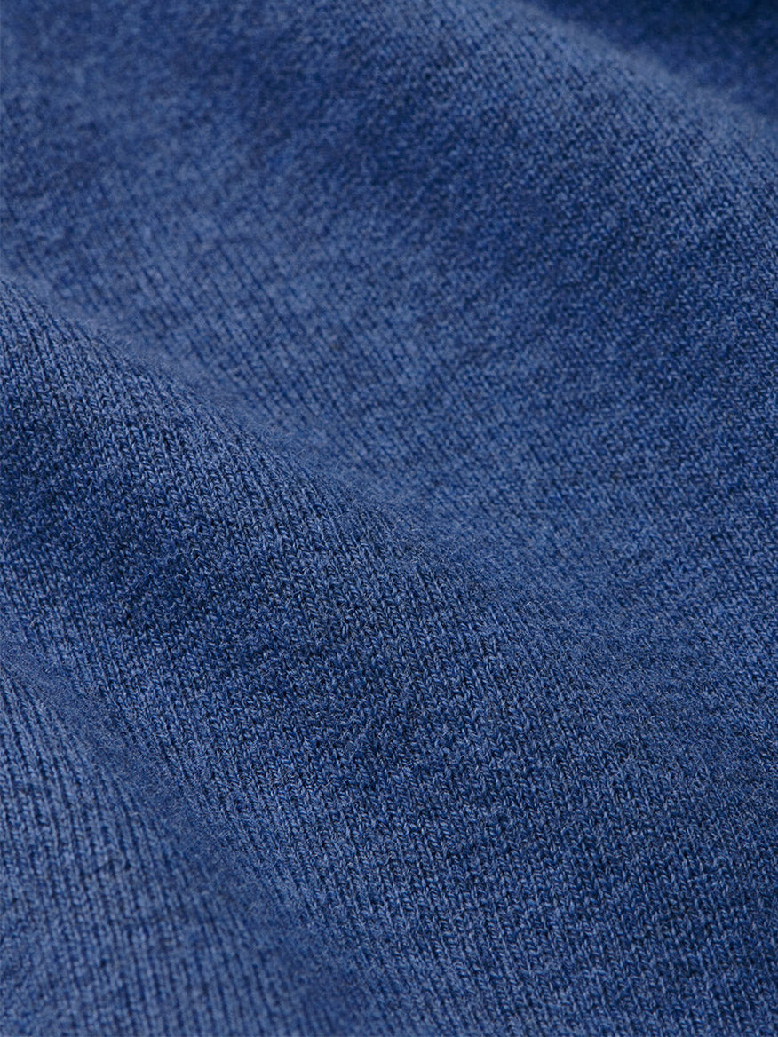 Close-up of the Windsor Blue Peter Millar Coolspun Lite Cotton Quarter-Zip Sweater, showing its blue textured knit pattern and soft, slightly wavy surface.
