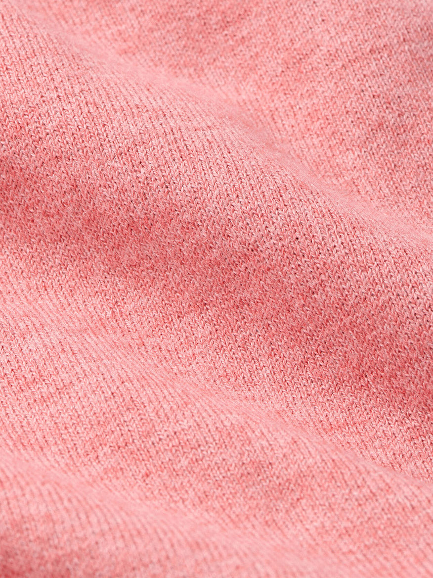 Close-up of the Peter Millar Coolspun Lite Cotton Quarter-Zip Sweater in Venetian Pink, showcasing its soft, textured knit and gentle folds, enhanced with Coolspun layers for a high-performance feel.