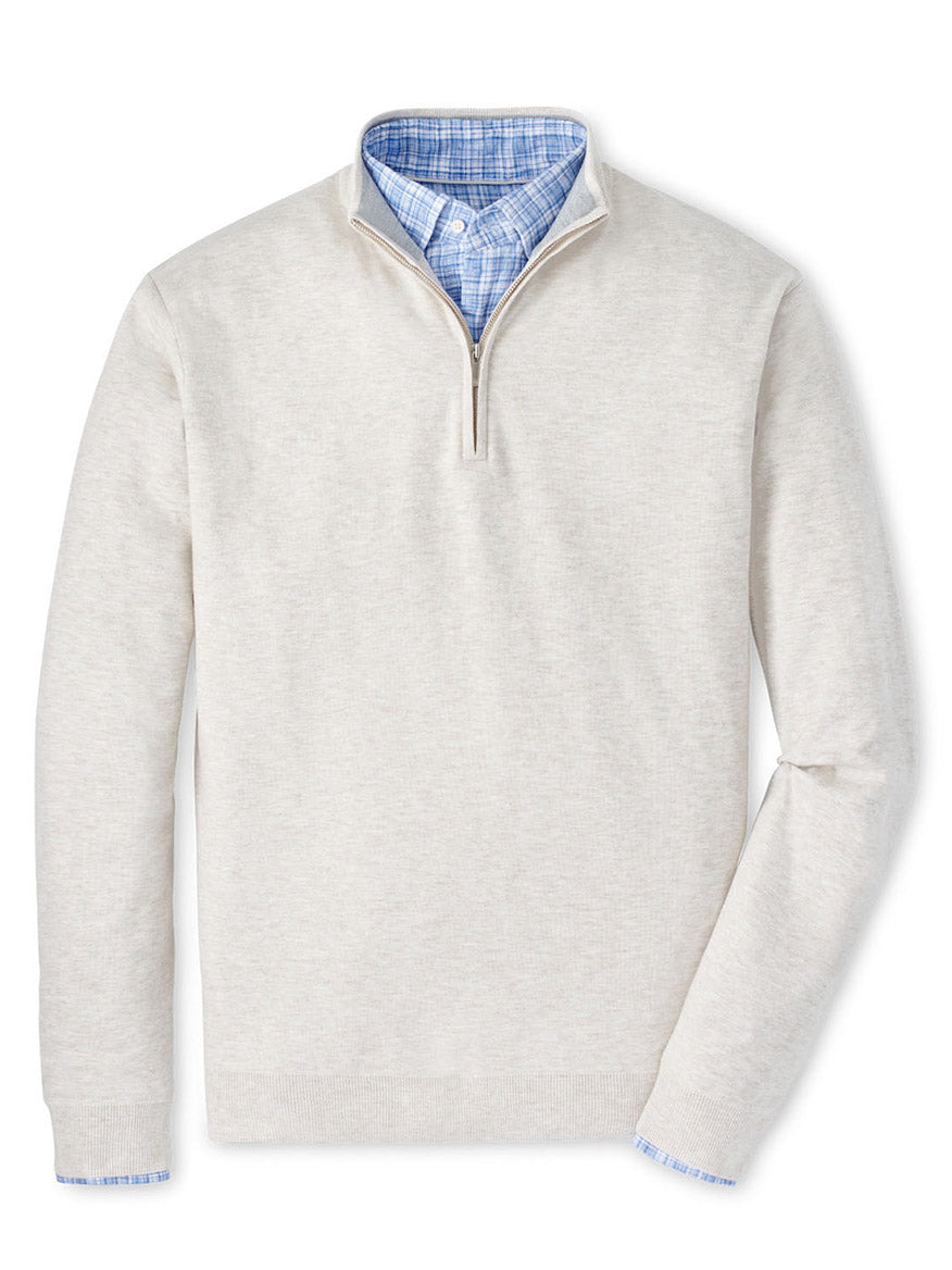 Layer the Peter Millar Coolspun Cotton Quarter-Zip Sweater in Ivory over a blue checkered shirt for a stylish look with its performance interior.