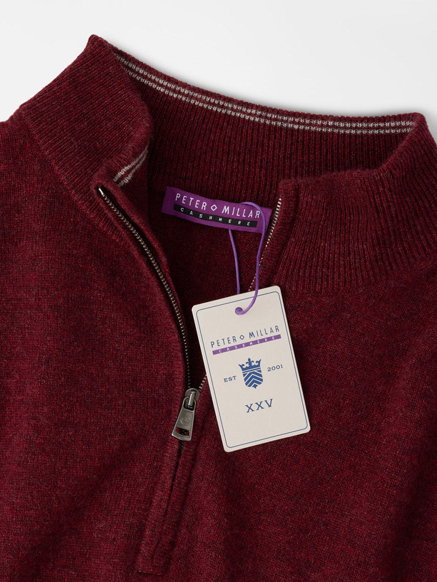 Peter Millar 25th Anniversary Cashmere Quarter-Zip Sweater in Bordeaux, featuring a metal zipper, brand neck label, and a limited-edition anniversary hang tag.
