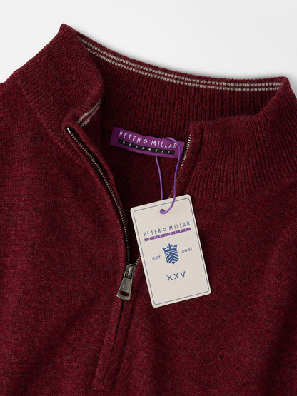 Peter Millar 25th Anniversary Cashmere Quarter-Zip Sweater in Bordeaux, featuring a metal zipper, brand neck label, and a limited-edition anniversary hang tag.
