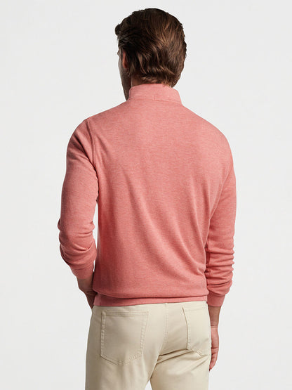 A man viewed from behind wearing a Peter Millar Crown Comfort Pullover in Clay Rose and tan pants.