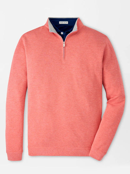 The Peter Millar Crown Comfort Pullover in Geranium features a coral quarter-zip design with a folded collar, contrasting dark blue lining, and four-way stretch for ultimate comfort.