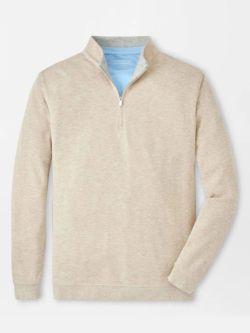 The Peter Millar Crown Comfort Pullover in Stone is showcased against a white backdrop, featuring a beige quarter-zip design with a light blue collar lining, providing a versatile lightweight layer ideal for any season.