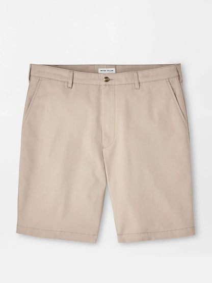 The Peter Millar Crown Comfort Short in Khaki features a classic fit, knee-length cut with belt loops, front pockets, and a button closure. Crafted from plain weave fabric and shown laid flat on a white background.