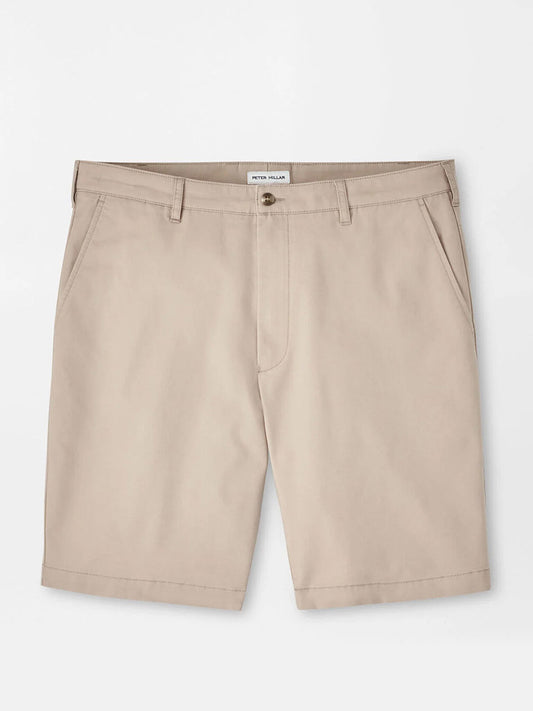 The Peter Millar Crown Comfort Short in Khaki features a classic fit, knee-length cut with belt loops, front pockets, and a button closure. Crafted from plain weave fabric and shown laid flat on a white background.