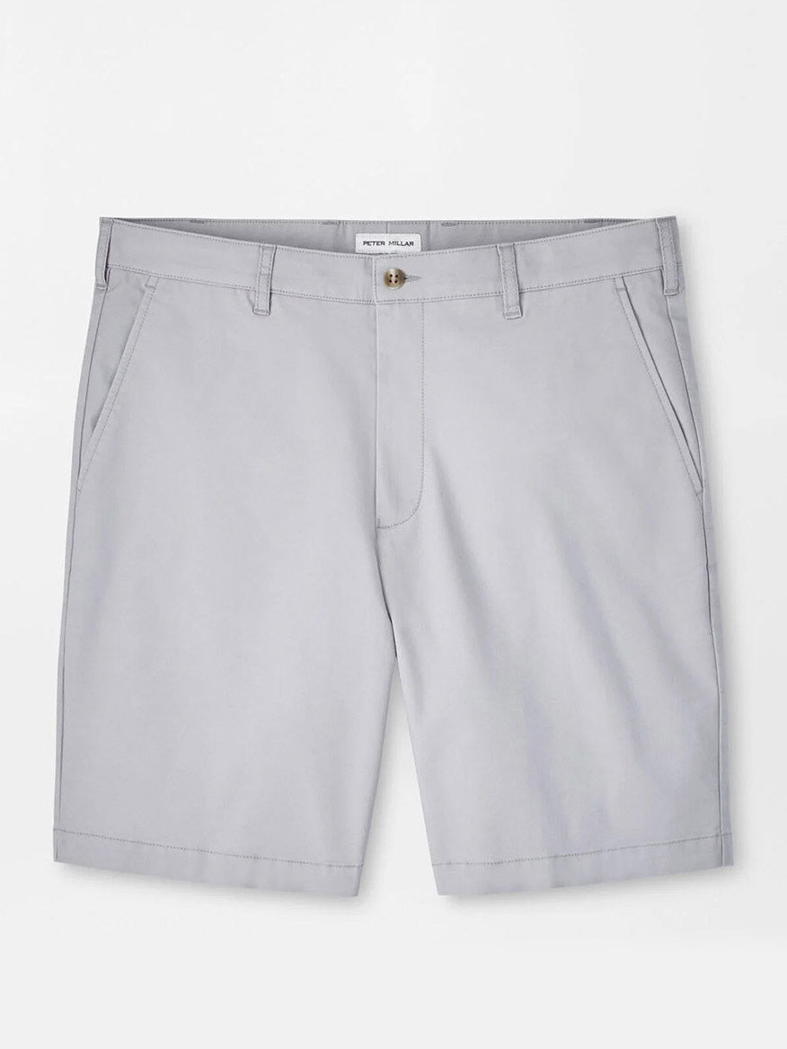 The Peter Millar Crown Comfort Short in Mountain Grey features knee-length, plain weave fabric, front pockets, belt loops, and a button closure—designed for modern mobility and shown against a plain white background.