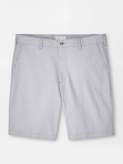 The Peter Millar Crown Comfort Short in Mountain Grey features knee-length, plain weave fabric, front pockets, belt loops, and a button closure—designed for modern mobility and shown against a plain white background.