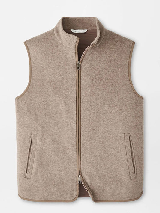 The Peter Millar Crown Flex Merino Vest in Grain is a beige, sleeveless zip-up crafted from stretch knit Merino wool with two front pockets—an ideal layer to elevate any look, shown against a plain background.