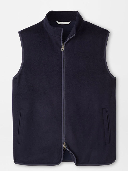 The Peter Millar Crown Flex Merino Vest in Navy, a sleeveless stretch knit wool vest with a full-length zipper and two front pockets, is displayed against a plain background—an ideal and versatile layering piece for any occasion.
