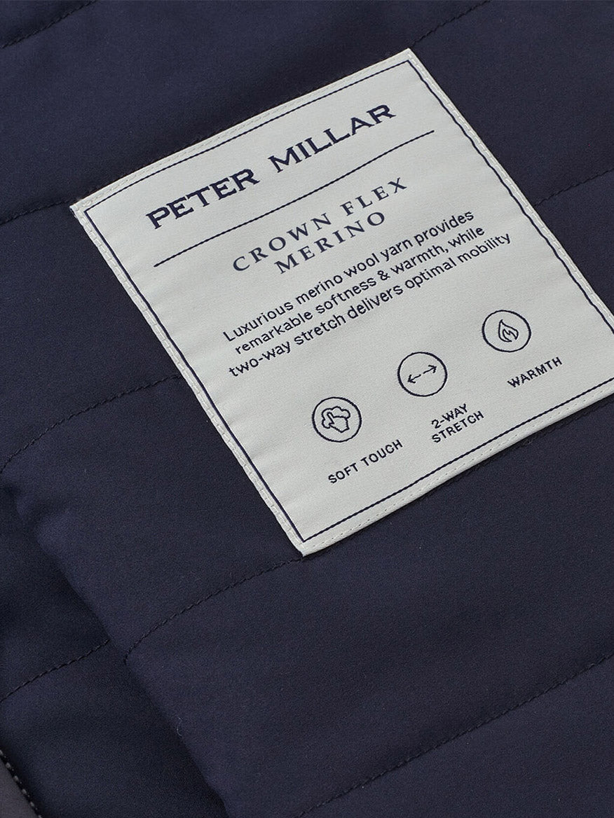 Close-up of the Peter Millar Crown Flex Merino Vest in Navy, made from stretch knit Merino wool for a soft feel, two-way stretch, and warmth—making it a versatile layering piece for any occasion.