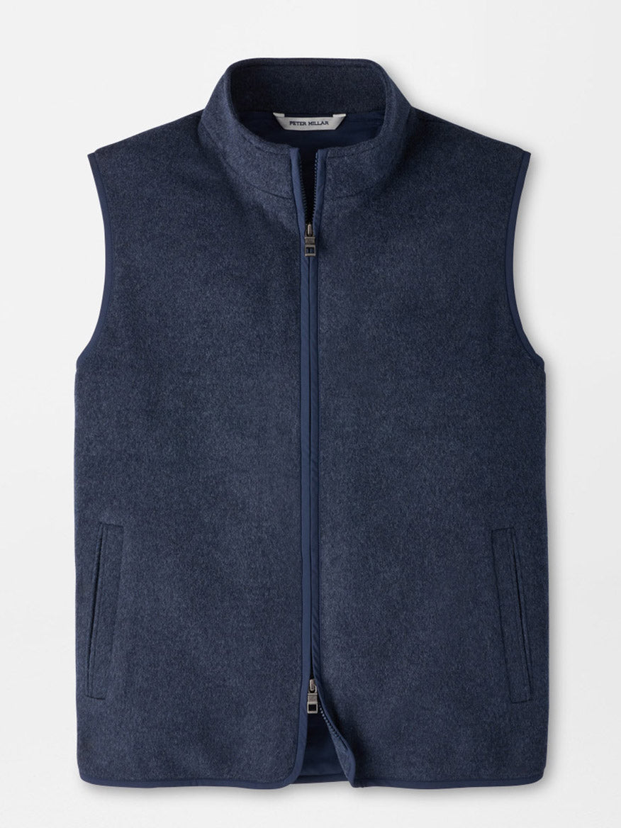 Peter Millar Crown Flex Merino Vest in Atlantic Blue, a dark blue sleeveless zip-up vest in a classic fit with a high collar, an insulated interior, and two side pockets.