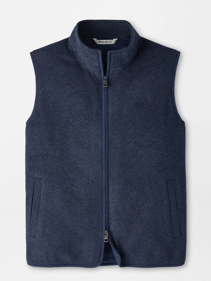 Peter Millar Crown Flex Merino Vest in Atlantic Blue, a dark blue sleeveless zip-up vest in a classic fit with a high collar, an insulated interior, and two side pockets.