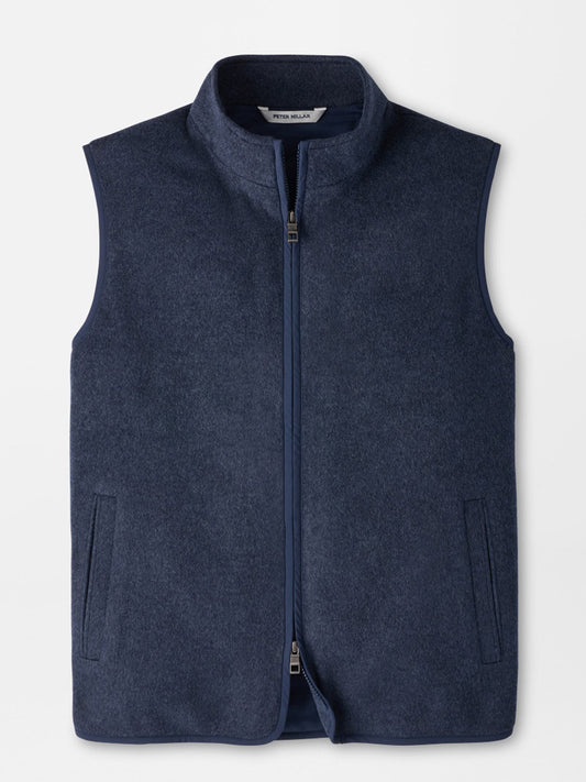 Peter Millar Crown Flex Merino Vest in Atlantic Blue, a dark blue sleeveless zip-up vest in a classic fit with a high collar, an insulated interior, and two side pockets.
