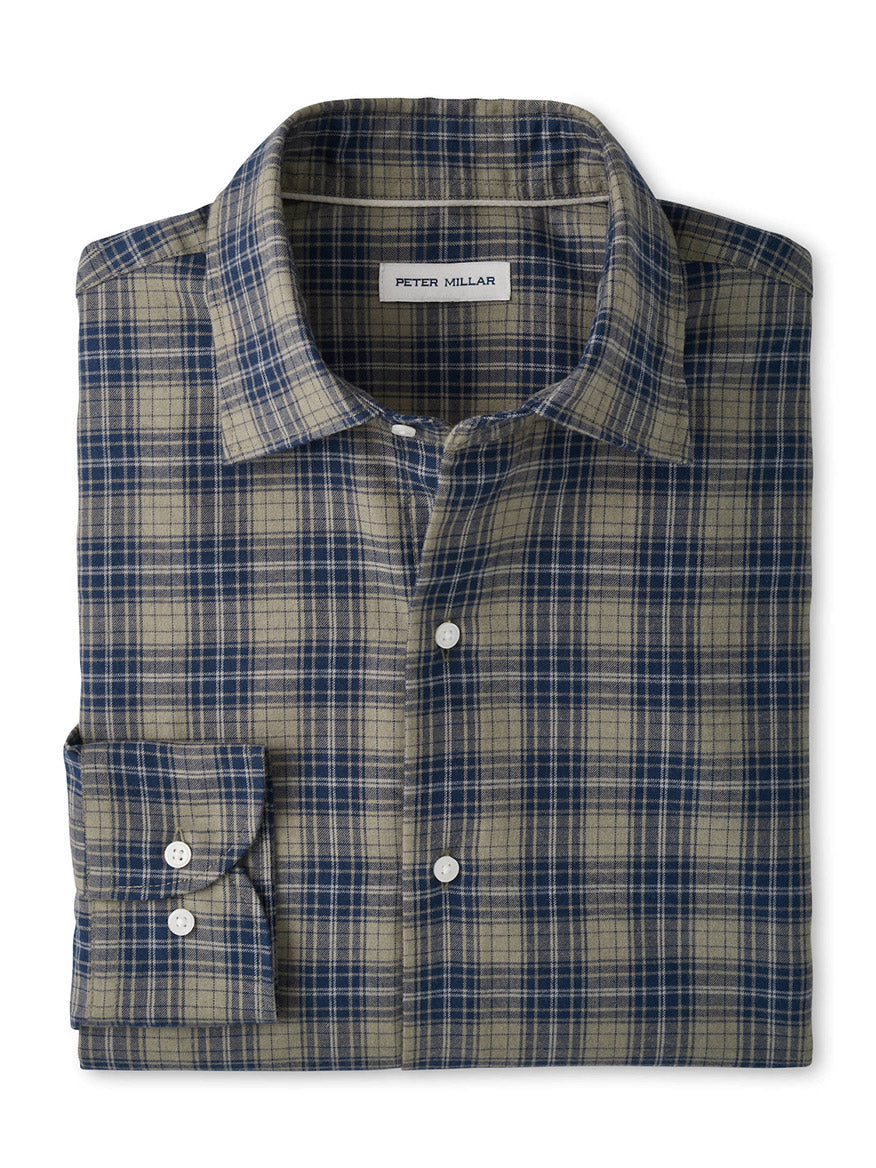 A folded, long-sleeve button-up shirt showcasing a blue and tan plaid pattern, with the “Peter Millar” label visible inside the collar. The Peter Millar Dean Performance Flannel Sport Shirt in Fatigue is crafted from soft performance fibers, blending timeless style with modern comfort—ideal for fans of Peter Millar flannels.