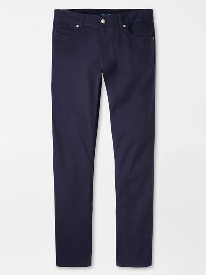 The Peter Millar Delvin Twill Five-Pocket Pant in Navy, designed for comfort with a tailored fit, is elegantly displayed on a plain white background.