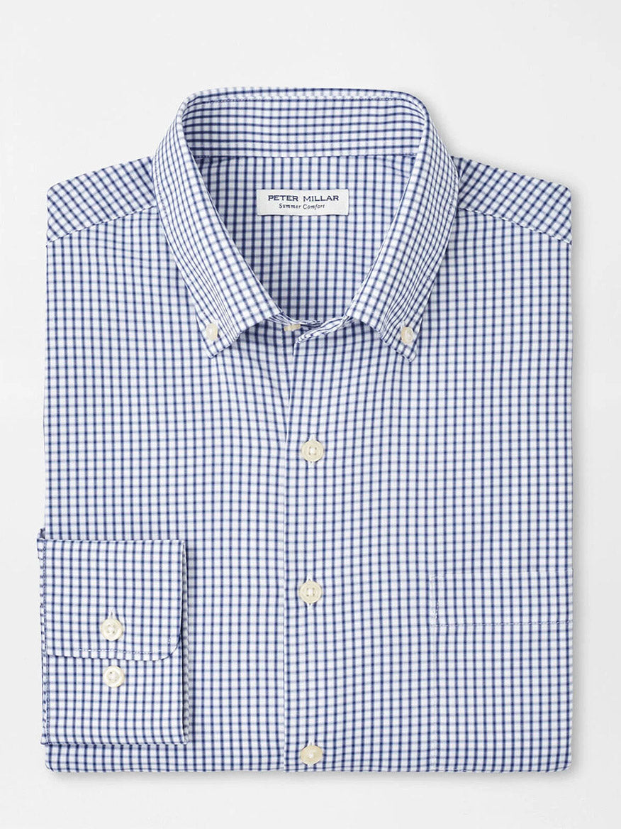 The Peter Millar Derwent Performance Twill Sport Shirt in Sport Navy is a folded blue and white checkered button-down shirt with a collar, providing excellent sun protection.