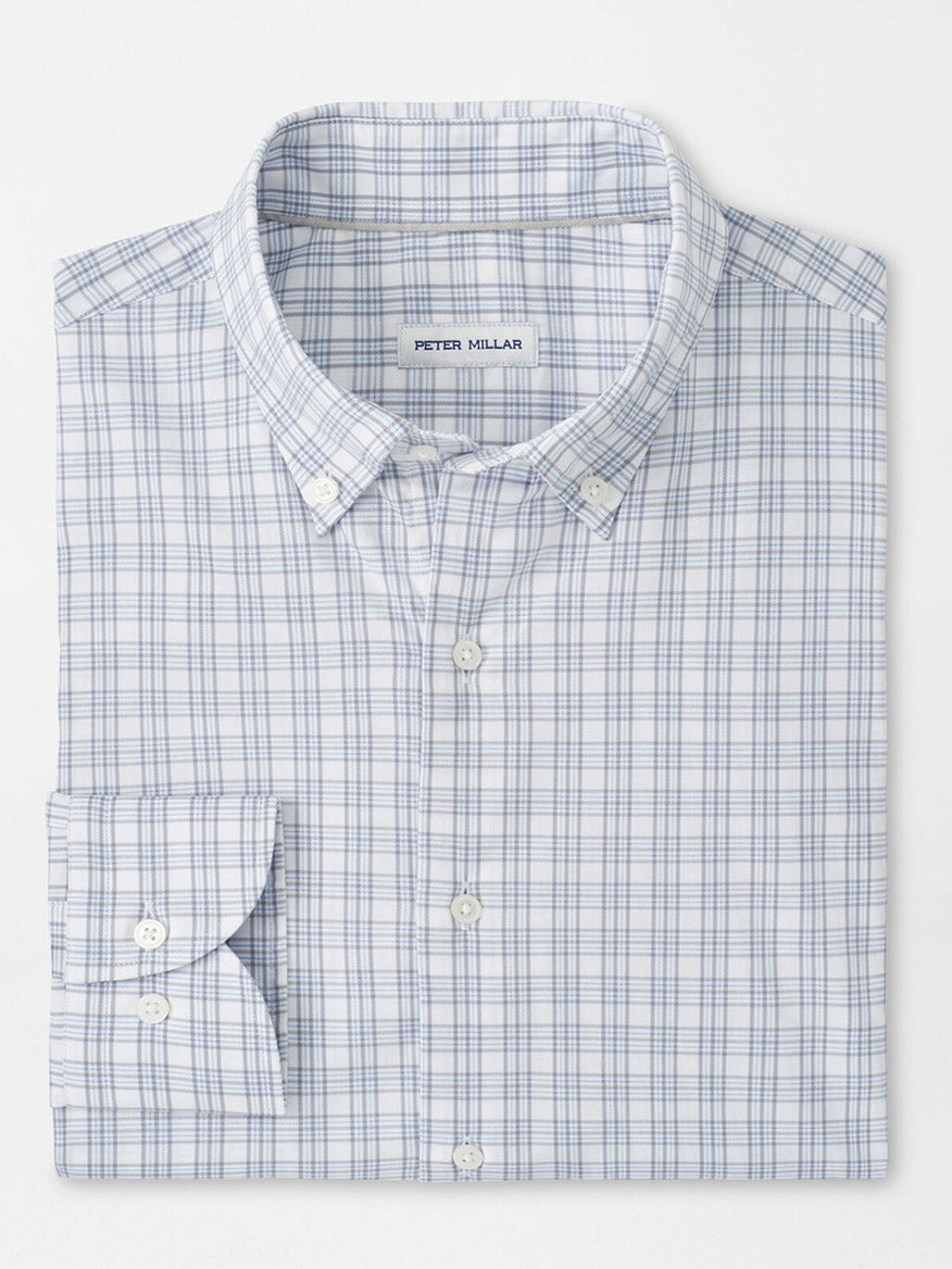 The Peter Millar Douglas Crown Lite Cotton-Stretch Sport Shirt in Gale Grey features a blue and light gray plaid pattern, classic fit, moisture-wicking stretch cotton, and a signature label on the inside collar.