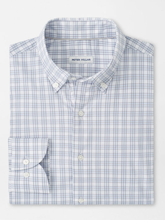 The Peter Millar Douglas Crown Lite Cotton-Stretch Sport Shirt in Gale Grey features a blue and light gray plaid pattern, classic fit, moisture-wicking stretch cotton, and a signature label on the inside collar.
