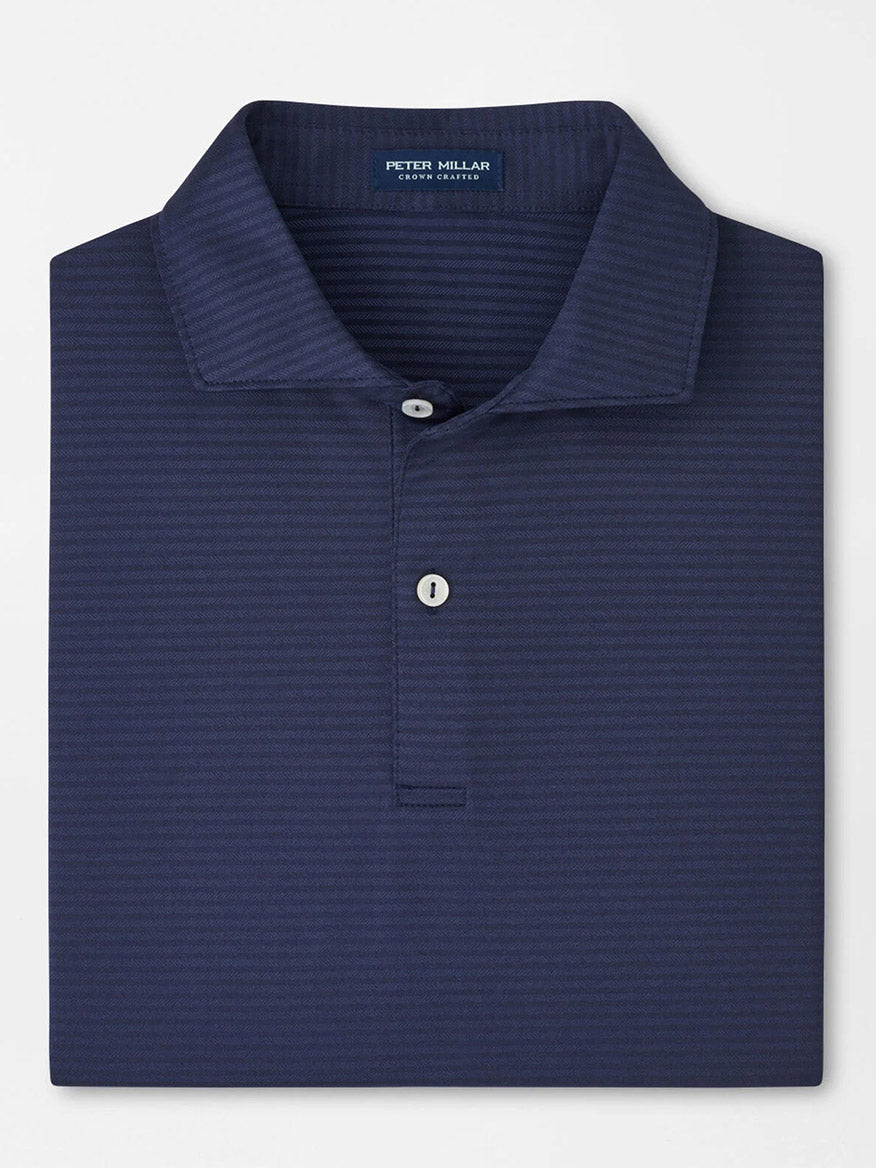 The Peter Millar Empire Performance Jersey Polo in Navy features a subtle stripe pattern, four-way stretch fabric, and a two-button placket for comfort and style.