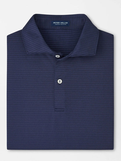 The Peter Millar Empire Performance Jersey Polo in Navy features a subtle stripe pattern, four-way stretch fabric, and a two-button placket for comfort and style.