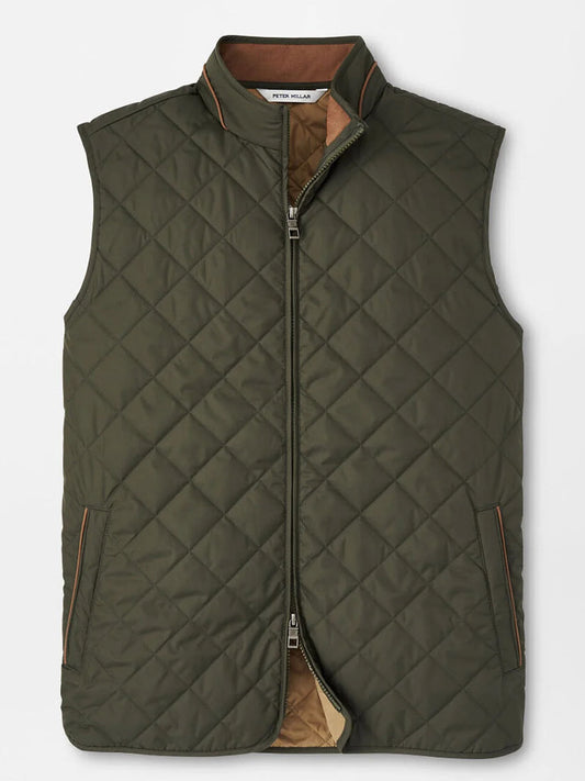 The Peter Millar Essex Vest in Dark Olive is a quilted, windproof vest featuring a front zipper, two side pockets with brown trim, and a standing collar.