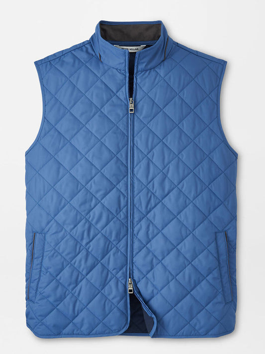 The Peter Millar Essex Vest in Astral Blue is a quilted, water-resistant vest with a front zipper and two side pockets, shown laid flat on a white background.