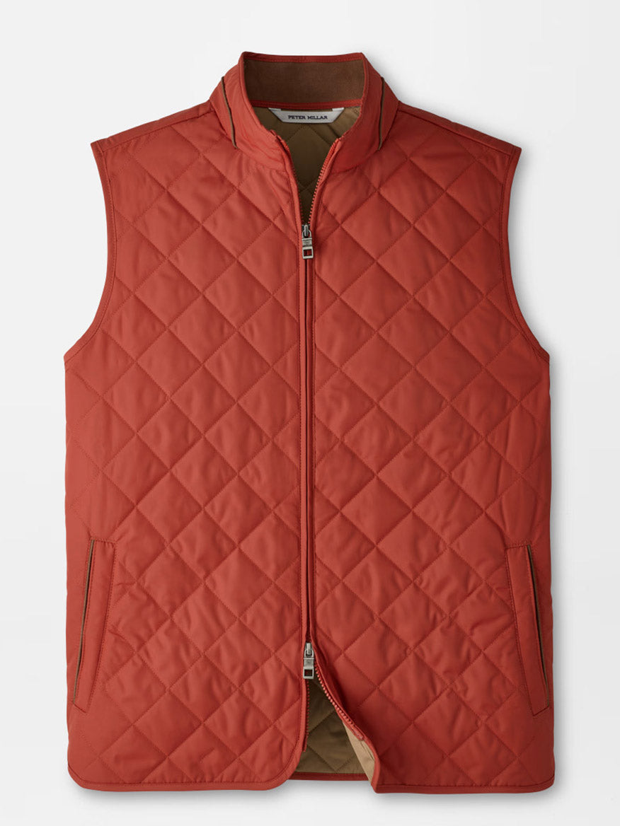 The Peter Millar Essex Vest in Burnt Orange, a sleeveless quilted vest featuring water-resistant fabric, a front zipper closure, and two side pockets, is laid flat on a white background.