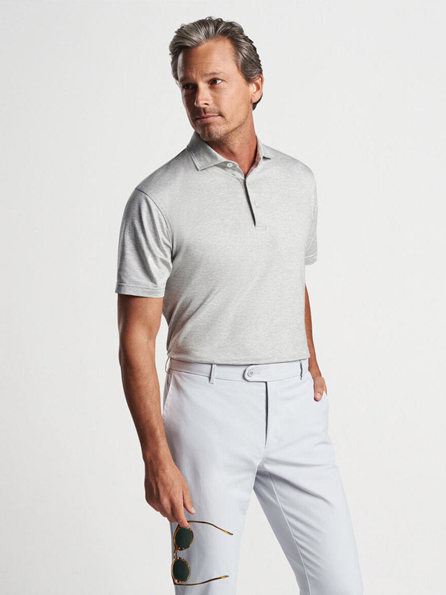 Peter Millar introduces their Peter Millar Excursionist Flex Short-Sleeve Polo in Gale Grey, featuring a tailored fit that is perfect for any man in search of comfortable and stylish attire.