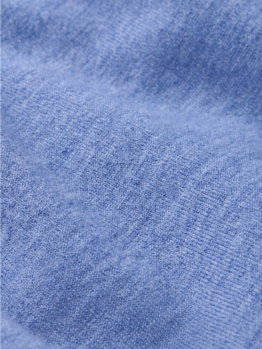 Close-up of navy textured fabric with visible knit pattern and gentle folds, ideal for the Peter Millar Excursionist Flex Quarter-Zip Sweater.
