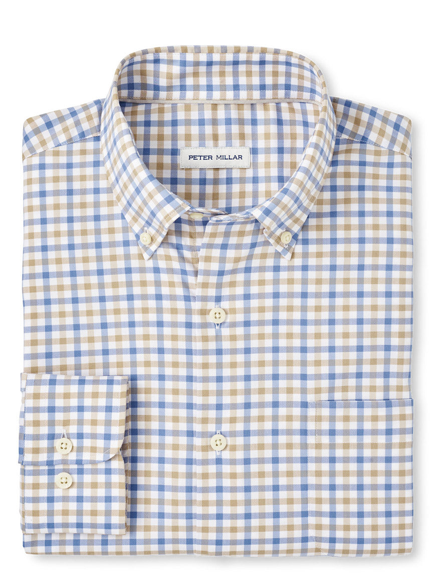 The Peter Millar Gardner Crown Lite Sport Shirt in Blue Freesia features a classic fit with a blue, beige, and white checkered pattern. It has a button-down collar and visible "Peter Millar" label, crafted from easy-care cotton-stretch fabric for effortless elegance.