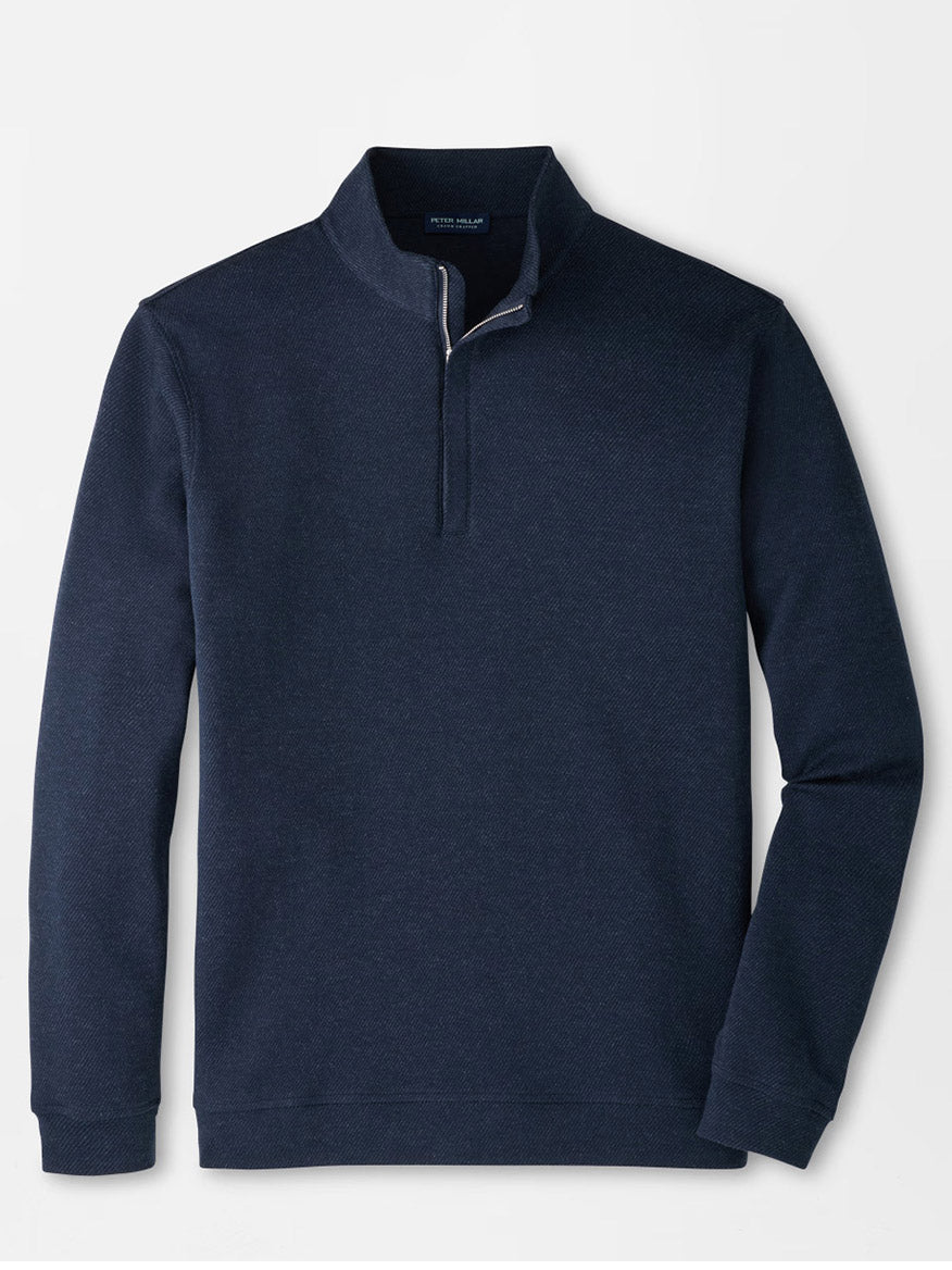 The Peter Millar Grant Knit Quarter-Zip in Navy is laid flat on a white background, showcasing its long sleeves and short collar. Made from a luxurious cotton-cashmere blend, this pullover provides both comfort and timeless style.